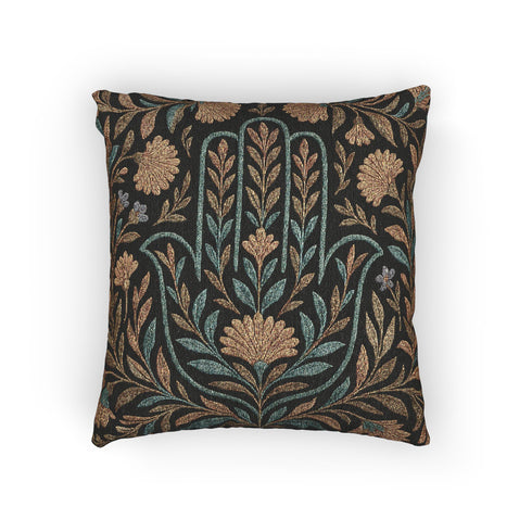 A 17x18 inch rectangular woven tapestry pillow featuring a golden Hamsa hand motif surrounded by embroidered botanical designs in teal, gold, and green on a dark green background. The double-sided pillow is filled with plush poly fill and sewn shut for a seamless finish. Crafted from a blend of 58% cotton and 42% polyester yarns, this decorative cushion is ideal for spiritual homes, altar decor, or whimsical, folklore-inspired living spaces.