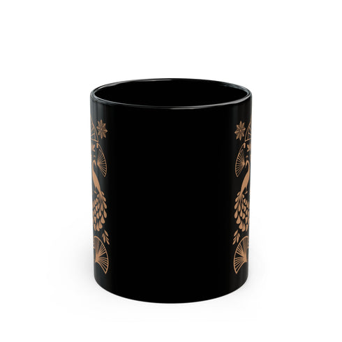A black ceramic mug featuring an Art Deco-inspired design in rose gold. The symmetrical pattern shows two peacocks with fan-shaped tails, surrounded by ginkgo fan motifs and floral elements. The central design includes a stylized flower with leaves, and decorative stars accent the composition. The mug has a classic C-shaped handle.