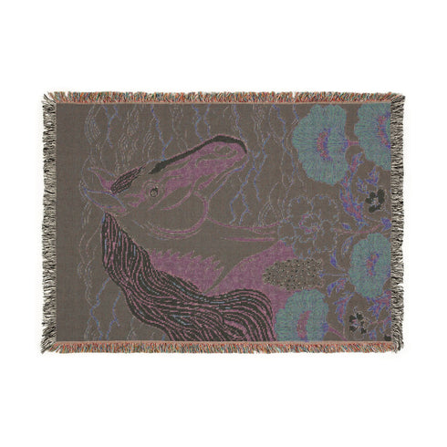 A Grimoire and Goblet woven cotton blanket featuring a large, stylized horse head in sage green and teal against a deep midnight navy background with wave patterns. The bottom edge features woven floral motifs in rust orange and deep plum. The design is a jacquard weave, not printed, with visible thread texture and multi-colored fringe edges. Chinoiserie and Art Nouveau style equestrian tapestry throw.