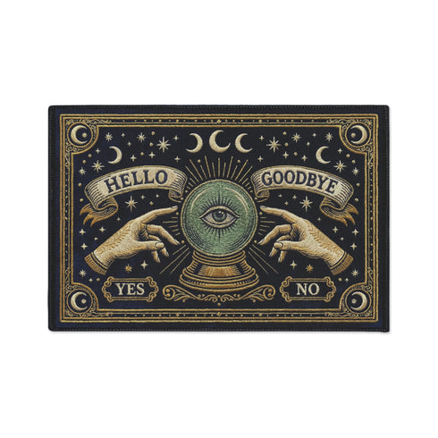 Grimoire and Goblet witchy doormat featuring a deep navy background with antique gold faux embroidered design of a crystal ball with central eye, surrounded by crescent moons, stars, and pointing hands, with ornate border and banner details, rectangular entryway rug with black trim and non-slip backing, mystical occult home decor mat for indoor or covered outdoor use