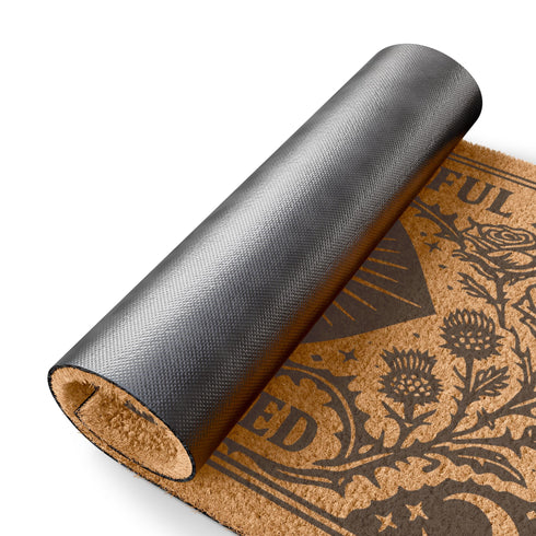 A premium 24x16 inch Grimoire and Goblet Warding Entry Mat featuring a centralized All-Seeing Eye medallion in high-contrast black vinyl on natural tan coconut coir. The design includes radial sunbursts, crescent moons, stars, and botanical roses and thistles. Serif text reads EVER WATCHFUL and EVER WARDED. The rug features a heavy-duty black vinyl backing for weather-resistant stability. Perfect for a luxury Victorian Gothic or Dark Academia entryway sanctuary.