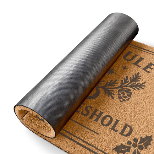 A rectangular tufted coir doormat with a non-slip black vinyl backing, features an intricate gothic botanical design in black. At the top, it reads "BLESSED YULE" with holly motifs in the corners. In the center, a laurel wreath, intertwined with a pentacle and a bell, encircles a radiant candle. Below the wreath rests a pinecone. At the bottom, the text "PROTECTED THRESHOLD" is flanked by holly. This pagan and witchy Grimoire and Goblet design is perfect for a gothic or dark academia entryway.