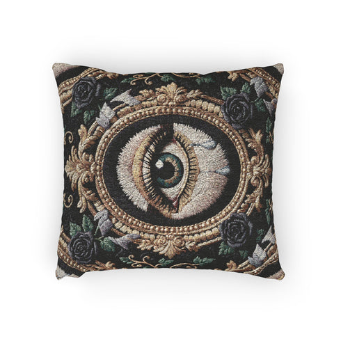 A square woven tapestry throw pillow by Grimoire and Goblet featuring a striking gothic design. The central motif is a large, detailed eye with a teal iris and light blue teardrops, set against pale skin. This eye is encased in an ornate, gold-toned baroque oval frame. The background is deep black, adorned with dark mauve roses and muted green foliage in the corners. The texture is a rich weave.