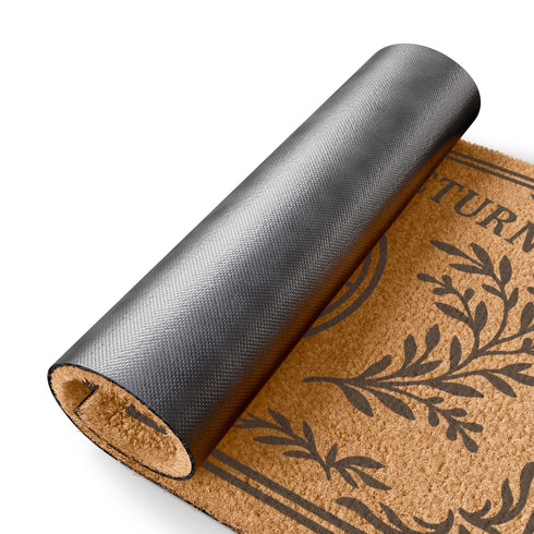 Natural coir doormat featuring "What Turns, Returns" text with sacred elemental symbolism including sun, crescent moon, flames, and botanical sprigs arranged in protective circular mandala design. Four classical elements represented in quadrants surrounded by intricate corner flourishes and leafy botanical borders. Perfect witchy welcome mat for pagan home decor, spiritual protection, and mystical entryway styling.