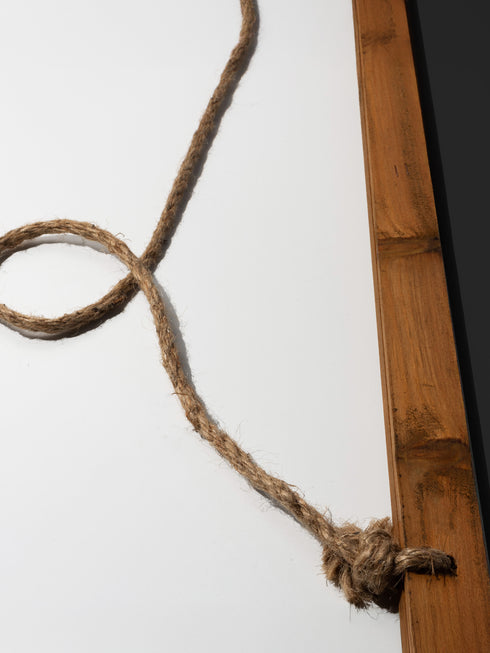 26x36 vertical tapestry featuring a feminine sun face surrounded by golden leaves and florals on a black background. Comes with stained wooden top and bottom dowels and natural twine for hanging. Made of silky polyester fabric with a smooth finish. Ideal for bohemian, celestial, or spiritual home decor themes.