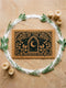 A rectangular natural tan doormat featuring a gothic celestial moon phase design in high-contrast black ink. The central crescent moon is detailed with mystical flourishes and surrounded by a symmetrical line of moon phases and twinkling stars. This 2D flat print is applied to coarse, tufted coconut coir fiber for a vintage grimoire aesthetic. The doormat includes a heavy-duty black vinyl non-slip backing and is designed as a functional accent for a dark academia or witchy porch entryway.