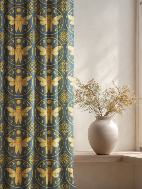 A single panel of a heavyweight blackout curtain with a rich, satiny texture. The design features a repeating pattern of large, golden cicadas, each framed within a celestial moon phase circle on a dark charcoal background. This moody entomology and lunar art is ideal for Dark Academia, Gothic, and Witchy interior aesthetics, providing both a dramatic statement piece and functional light-blocking for a bedroom, library, or living room.