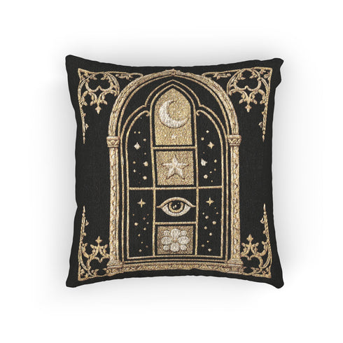 Woven jacquard throw pillow by Grimoire and Goblet featuring a gothic cathedral arch window design in black and gold. Central motifs include a waxing crescent moon, a five-pointed celestial star, a protective all-seeing eye, and a blooming botanical flower. Texture is raised tapestry weave, not printed. Perfect for dark academia, whimsigoth, and witchy home decor styles. Black background with beige and ochre accents. Square shape 17x18 inches.