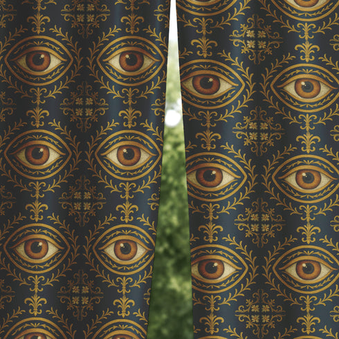 A single panel of a heavyweight blackout curtain with a rich, satiny texture. The design features a repeating pattern of a realistic, all-seeing evil eye, each framed within an ornate, golden Victorian botanical flourish on a dark charcoal background. This mystical art is ideal for Dark Academia, Gothic, and Witchy interior aesthetics, providing both a dramatic statement piece and functional light-blocking for a bedroom, library, or sacred space.