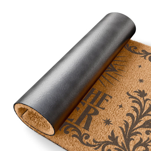 Coir doormat printed with “Beware the Watcher” in black ink, featuring a central all-seeing eye, ornate floral border, and star accents. Shown on outdoor stairs and entryways. Made from natural coconut fiber with black vinyl backing. A bold, mystical gift for witches, goth home lovers, and spiritual housewarmings.