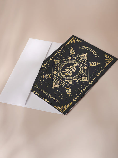 Peppermint-themed holiday ritual card featuring a gold-stylized peppermint design with celestial and ornate accents on the front and an inside message highlighting peppermint's historical significance and its use in rituals for purification and prosperity, including steps for New Year's practices.