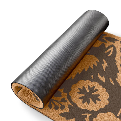 A rectangular, eco-friendly coir doormat with a natural, light brown tufted coconut fiber. Features a striking, symmetrical black folk-art design. In the center, two foxes face each other, noses touching, in a heraldic pose. They are surrounded by a dense, Scandinavian-style botanical border of stylized flowers, leaves, and branches, evoking a mystical woodland or dark cottagecore aesthetic. This witchy, Art Nouveau-inspired design serves as an elegant, gothic, or pagan piece of entryway decor.