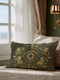 A rectangular lumbar pillow cover in a deep olive green, featuring a prominent All-Seeing Eye design at its center. The eye is rendered in rich gold and royal blue tones, detailed to emulate the intricate texture of fine embroidery. Golden Art Nouveau-style botanical flourishes with leaves and flowers frame the central eye, extending across the linen-feel polyester fabric. This gothic and dark academia style accent cushion is designed for mystical home decor, serving as a protective talisman.