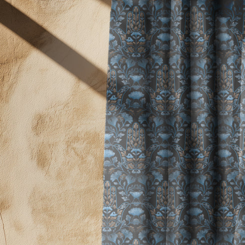 Sheer curtain panel featuring repeating gold hamsa hands surrounded by blue botanical flowers and leaves on dark navy background. Linen-textured polyester fabric filters light while providing elegant window covering with protective symbolism for bohemian or Victorian interiors.