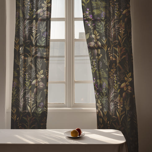 Sheer curtain panel featuring an intricate vertical pattern of wild botanicals including purple flowers, golden leaves, and silvery fronds against a dark charcoal background. The design shows detailed herbarium-style illustrations.