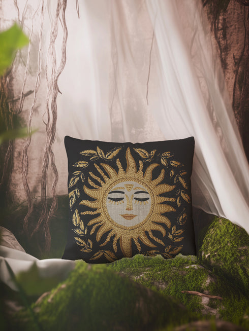 Black woven throw pillow with golden embroidered sun and laurel design, featuring a serene celestial face with closed eyes.