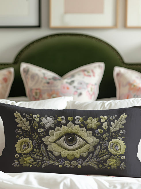 All-seeing eye botanical lumbar pillow with mystical herbal embroidery on dark navy fabric. Gothic cottagecore throw pillow featuring protective third eye symbol surrounded by sage botanicals, oak leaves & wildflowers. Witchy home decor with medieval tapestry aesthetic. Perfect for bohemian spiritual spaces, pagan decor & occult art lovers. 20x12 lumbar size.