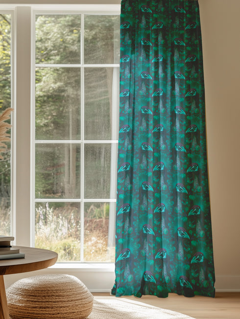 A sheer curtain panel in emerald green featuring a repeating pattern of raven silhouettes and Victorian botanical fan motifs. The fabric has a semi-transparent, linen-like texture.