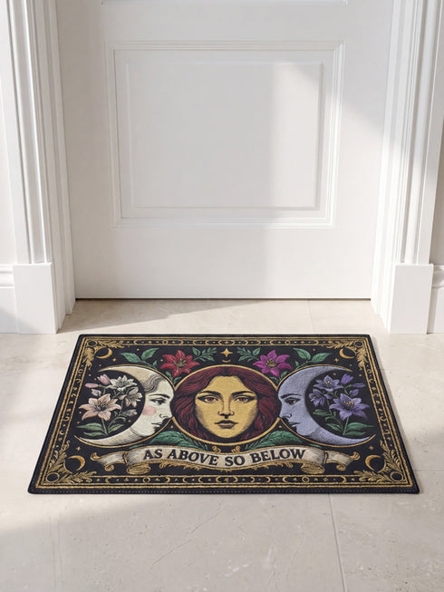 A triple moon doormat featuring the sacred symbol of maiden, mother, and crone, rendered in antique gold on a black ground with botanical detailing—designed for witchy homes, Wiccan spaces, and those drawn to divine feminine symbolism