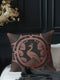 Square pillow cover featuring a stylized copper peacock design centered in a medallion, surrounded by Art Deco fan patterns and shell motifs on a dark forest green background.