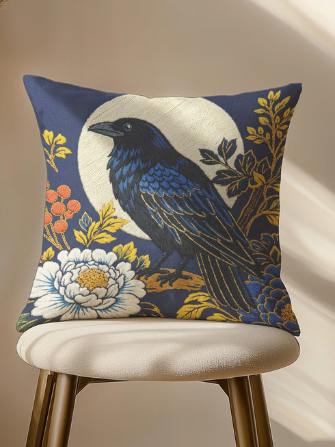 Grimoire and Goblet pillow cover featuring a black raven perched on vintage leather books. The design uses a faux embroidery effect printed on smooth premium polyester fabric. Dark academia aesthetic with moody navy, sepia, and gold tones. Detail shows linen-like texture of the fabric and the hidden zipper closure. Perfect for gothic home decor, reading nooks, or library accents.