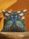 Close up of Grimoire and Goblet peacock pillow cover featuring a high-fidelity faux embroidery print. The design showcases two symmetrical peacocks in midnight charcoal and antique gold, facing each other in a medallion layout surrounded by rust and cream floral vines. The image details the printed illusion of hand-stitched tapestry texture on smooth, soft polyester fabric. Ideal for Dark Academia, Whimsigoth, and Art Nouveau vintage home decor styles. Double-sided print with hidden zipper.