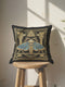 Grimoire & Goblet black pillow cover featuring a faux embroidery style printed design of a death’s-head moth with a skull motif, muted blue wings, antique gold linework, classical columns, geometric borders, small stars, and an all-seeing eye within a triangle. Square decorative pillowcase with double-sided print, hidden zipper, and linen-feel polyester finish for gothic, dark academia, and occult home decor.