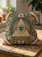 A square decorative pillowcase cover featuring a centralized, intricate medallion design printed on smooth, linen-like fabric. The prominent focal point is a large Eye of Providence, depicting a single eye inside a cream-colored triangle, backed by a golden radial sunburst. The design is framed by elaborate, Art Nouveau-style swirling floral filigree and vine motifs in shades of gold, deep red, and cream, all set against a rich, dark teal green background.