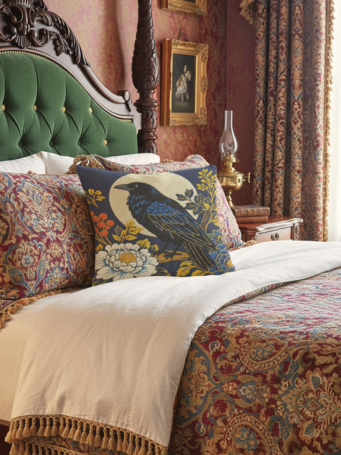 Grimoire and Goblet pillow cover featuring a black raven perched on vintage leather books. The design uses a faux embroidery effect printed on smooth premium polyester fabric. Dark academia aesthetic with moody navy, sepia, and gold tones. Detail shows linen-like texture of the fabric and the hidden zipper closure. Perfect for gothic home decor, reading nooks, or library accents.