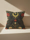A square decorative pillow cover by Grimoire and Goblet featuring a symmetrical Dark Academia design on a charcoal background. Two black crows face each other beneath a gold crescent moon and eight-pointed star. The birds are flanked by rust-red and cream botanical flowers with sage green leaves. The artwork mimics the look of textured embroidery but is a smooth 2D print. The design is mirrored on both sides. Perfect for gothic decor.