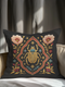 A square, dark charcoal pillow cover with a linen-feel texture, featuring an intricate, embroidered-style design. At the center, a large Egyptian scarab beetle in gold and turquoise is framed by a red and gold quatrefoil border. Symmetrical blush-pink poppies and smaller blue and red flowers with golden foliage flank the central motif, creating a lush botanical scene. Small celestial stars in gold and blue are scattered, adding a mystical, celestial element to this piece of dark academia decor.