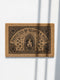 Rectangular coir doormat woven from natural brown coconut fiber with a bristly low pile. A bold black printed design fills the surface: a pointed archway frames a cast iron cauldron with rising flames at the center, flanked by winding ivy vines and small crescent moons. Arched lettering across the top reads PROTECTED BY HEARTH AND HERB. The four corners hold medieval shields and ornamental medallions, all enclosed by a thick black rectangular border with finished edges.