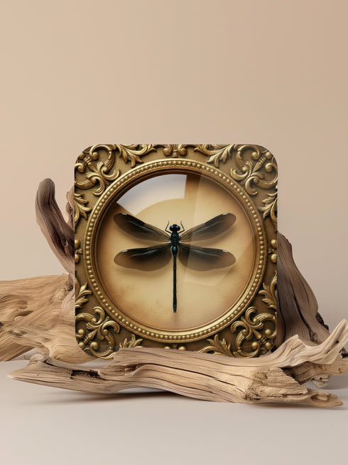 Set of four luxury coasters featuring taxidermy inspired specimen entomology art, showcasing detailed illustrations of beetles and dragonflies encapsulated within ornate, gold baroque frames. The square drink coasters are crafted from masonite hardboard with a waterproof high-gloss finish, protecting delicate surfaces during dining rituals. Essential gothic barware, complementing any fine cocktail, esoteric tea, or wine served in a Goblet. A premium curio cabinet accent by Grimoire and Goblet.