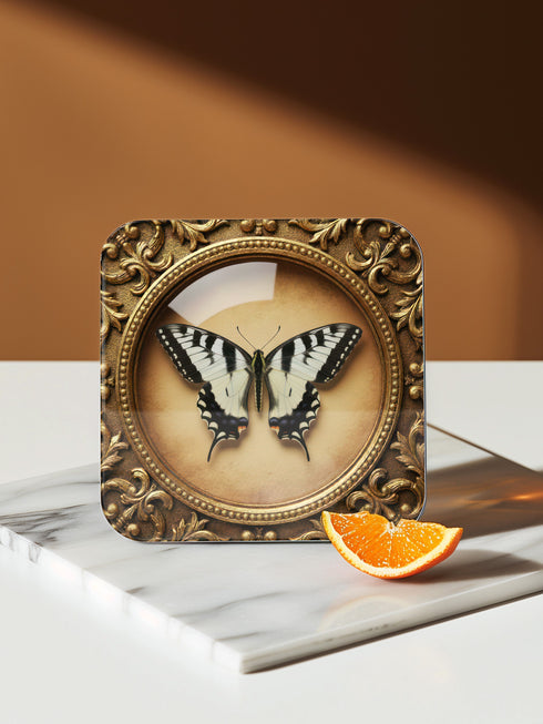 Grimoire and Goblet offers this luxury four-piece square Coaster Set featuring glossy, dome-covered, Taxidermy-inspired Entomology butterfly specimens, framed in ornate Victorian Gothic style. The resilient hardboard foundation and non-slip cork backing provide premium, waterproof protection for fine cocktails and esoteric teas. The collection includes purple, green, white, and peacock butterfly art, ideal for Dark Academia, Oddity, and Curio Cabinet decor.