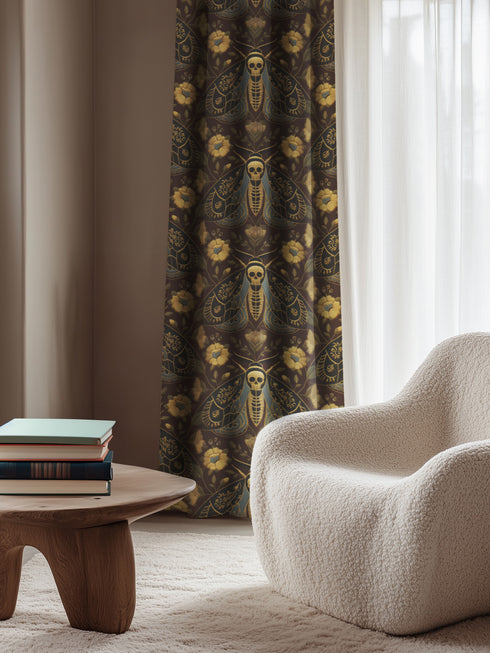 Grimoire and Goblet blackout curtains featuring a repeating Death's Head Moth pattern. The design utilizes a trompe-l'œil effect to mimic raised gold embroidery on a deep espresso brown background. The moths feature skull thoraxes and slate blue wings, surrounded by antique gold peonies and vines in a symmetrical damask layout. The fabric is a smooth, satiny heavyweight polyester with a white reverse side, offering light-blocking functionality.