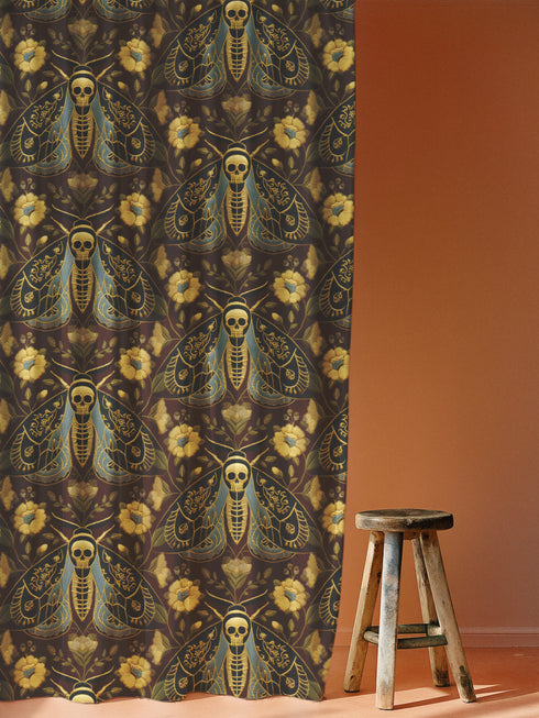 Grimoire and Goblet blackout curtains featuring a repeating Death's Head Moth pattern. The design utilizes a trompe-l'œil effect to mimic raised gold embroidery on a deep espresso brown background. The moths feature skull thoraxes and slate blue wings, surrounded by antique gold peonies and vines in a symmetrical damask layout. The fabric is a smooth, satiny heavyweight polyester with a white reverse side, offering light-blocking functionality.