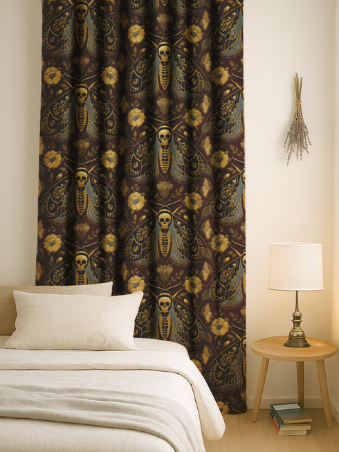 Grimoire and Goblet blackout curtains featuring a repeating Death's Head Moth pattern. The design utilizes a trompe-l'œil effect to mimic raised gold embroidery on a deep espresso brown background. The moths feature skull thoraxes and slate blue wings, surrounded by antique gold peonies and vines in a symmetrical damask layout. The fabric is a smooth, satiny heavyweight polyester with a white reverse side, offering light-blocking functionality.