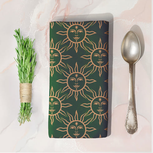 Elegant forest green cloth napkins featuring a golden sun motif, crafted from durable polyester in a set of four, perfect for refined dining.
