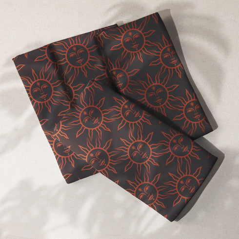 Elegant black cloth napkins with a deep red celestial sun motif, crafted from polyester in a four-piece set, designed for sophisticated dining.
