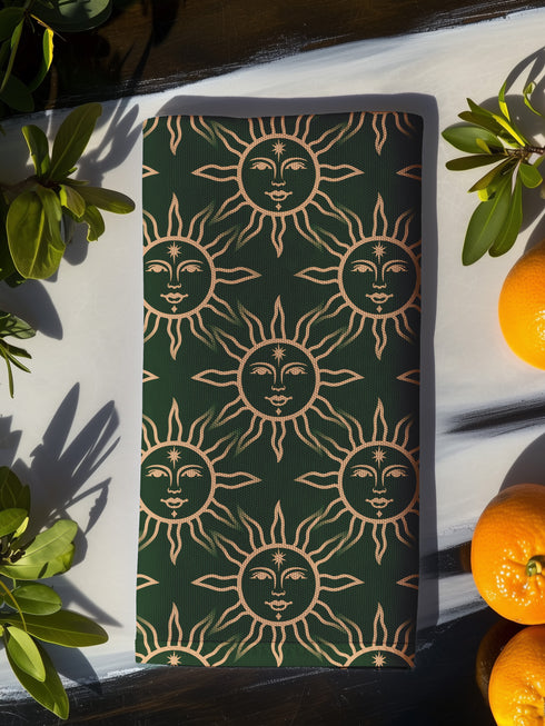 Elegant forest green cloth napkins featuring a golden sun motif, crafted from durable polyester in a set of four, perfect for refined dining.
