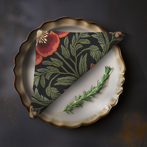 A four-piece cloth napkin set featuring oversized embroidered-style red poppy flowers with green foliage on a deep black background; square-shaped, made of soft polyester with one-sided print and white reverse.