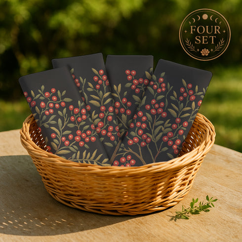 A 4-piece cloth napkin set featuring an embroidered-style illustration of a rowan tree branch with clusters of red berries and green leaves on a deep black background. Each napkin is square-shaped, made from soft polyester with a single-sided print and white reverse, perfect for mystical or autumn dining.