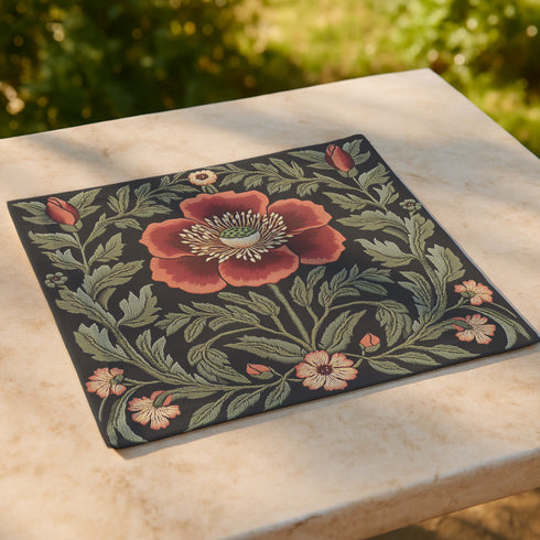 A four-piece cloth napkin set featuring oversized embroidered-style red poppy flowers with green foliage on a deep black background; square-shaped, made of soft polyester with one-sided print and white reverse.