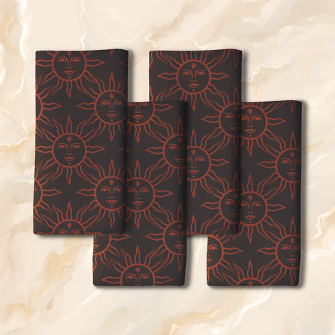 Elegant black cloth napkins with a deep red celestial sun motif, crafted from polyester in a four-piece set, designed for sophisticated dining.