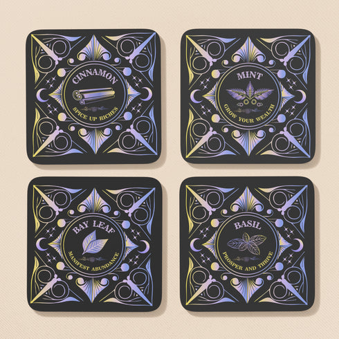 Four black square coasters with shimmering holographic designs. Each features a different herb (Mint, Basil, Bay Leaf, Cinnamon) and associated wealth-attracting phrase in ornate lettering.