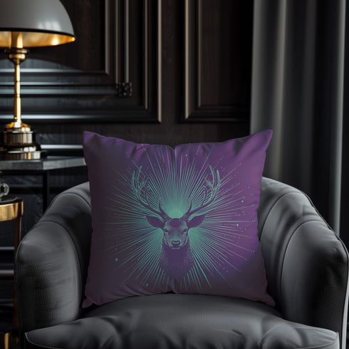 A pillow cover with a bold stag's head emerging from an ethereal burst of mint green rays against deep purple fabric. Delicate starbursts scatter around the deer, creating a celestial effect.