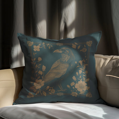 Teal throw pillow cover featuring a golden raven illustration surrounded by intricate floral designs, suitable for gothic or dark academia decor.