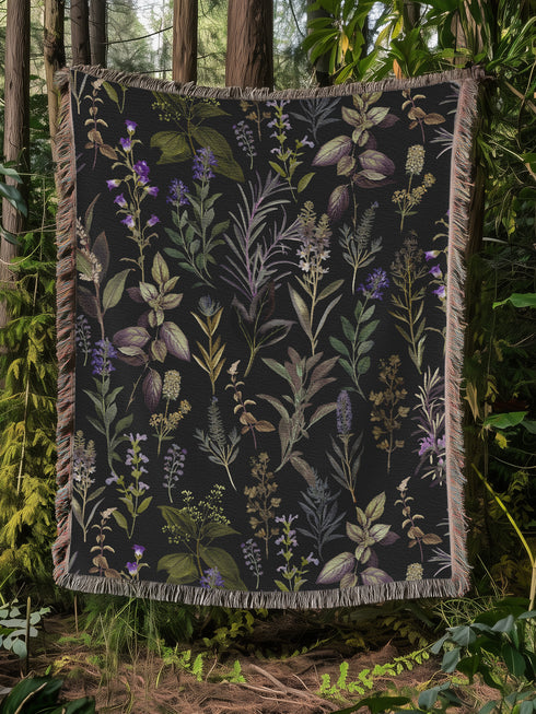 Forest green cotton throw blanket with woven silver moon phases and golden sun motifs, finished with multicolored fringe trim.