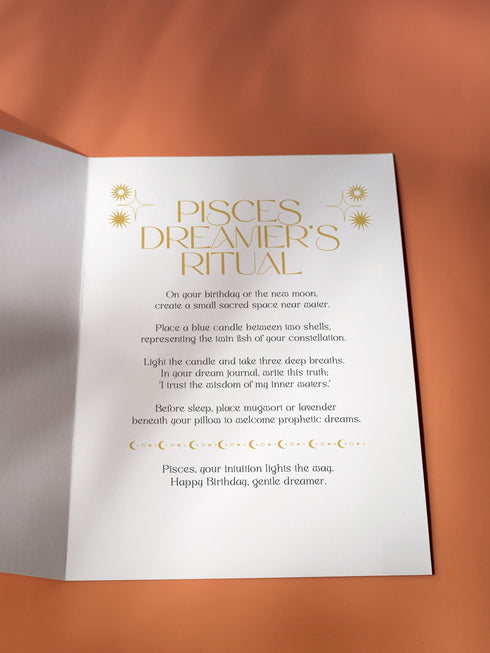 Luxurious black and gold Art Deco birthday card featuring twin fish in circular mandala design with geometric patterns. Contains Pisces dream ritual. Perfect for mystics and dreamers who appreciate elegant artwork.