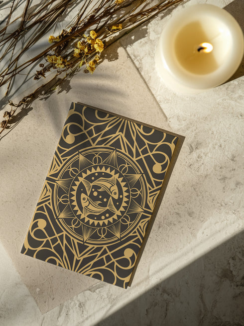 Luxurious black and gold Art Deco birthday card featuring twin fish in circular mandala design with geometric patterns. Contains Pisces dream ritual. Perfect for mystics and dreamers who appreciate elegant artwork.